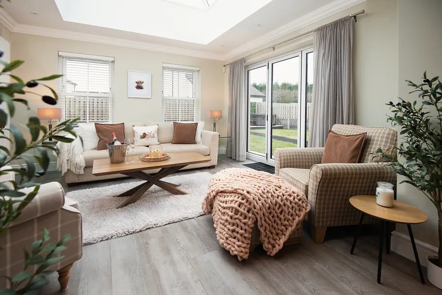 Second lounge under a roof lantern with doors to the garden